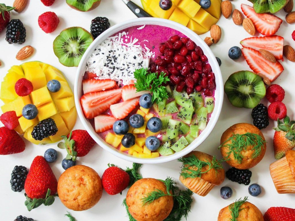 pexels-photo-1092730-1092730 pregnancy health, top tips, Vibrant smoothie bowl topped with assorted fresh fruits and muffins, perfect for a healthy snack.